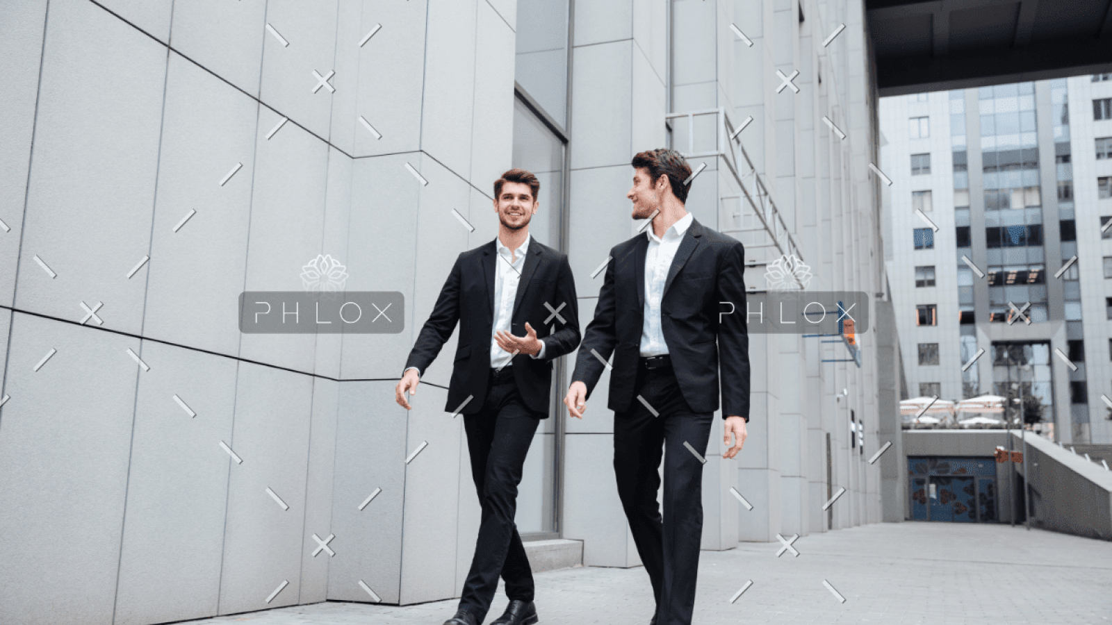 demo-attachment-922-two-businessmen-walking-and-talking-in-the-city-PMW8E26